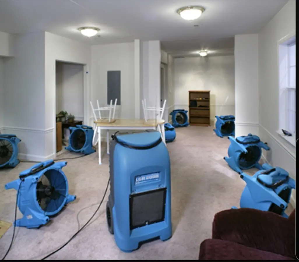 Air movers and dehumidifier setup for Water Damage Restoration in Leoni